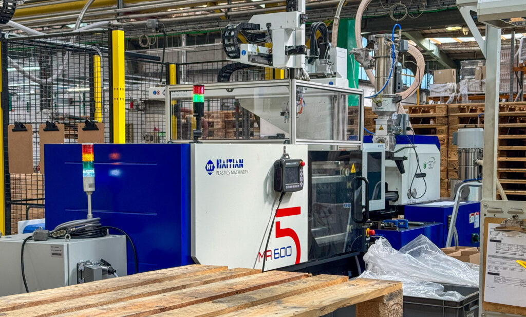The newly installed Haitian 60-ton injection moulding machine operating on the factory floor at Flambeau Europe’s Manston site.
