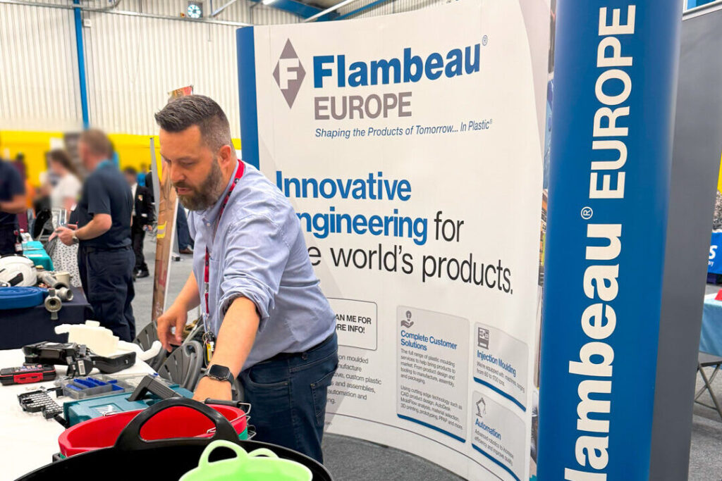Flambeau Europe employee attending careers fair, explaining injection moulding career paths