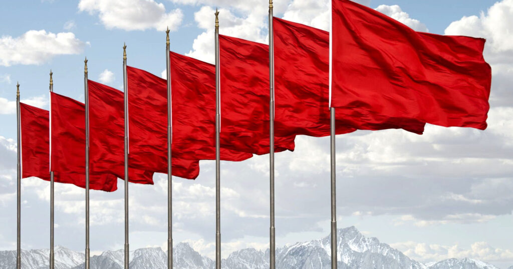 Image illustrating red flags in a line, representing the red flags to avoid when choosing an injection moulding partner.