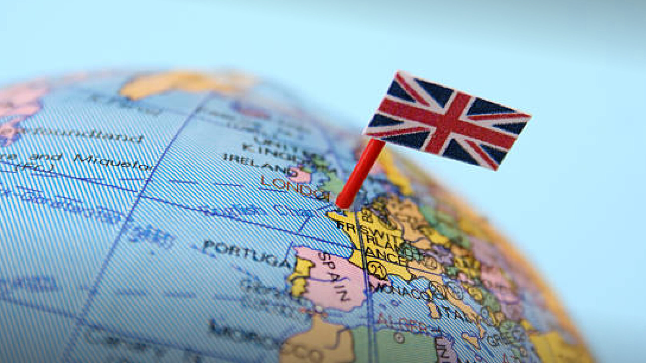 Injection moulding investment supporting UK manufacturing: globe highlighting the UK with flag marker